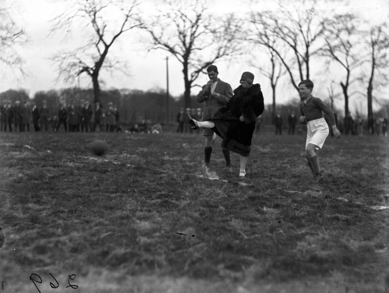Woman kicking ball at football match Falkirk Council Woman kicking ball at football match Falkirk Council