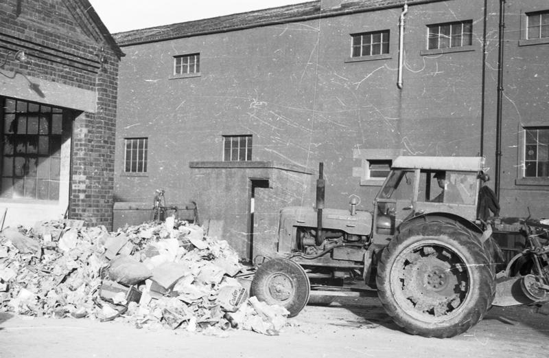 Brockville. Using rubber blade to move refuse Falkirk Council