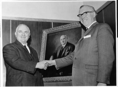 William Young being presented with his portrait.