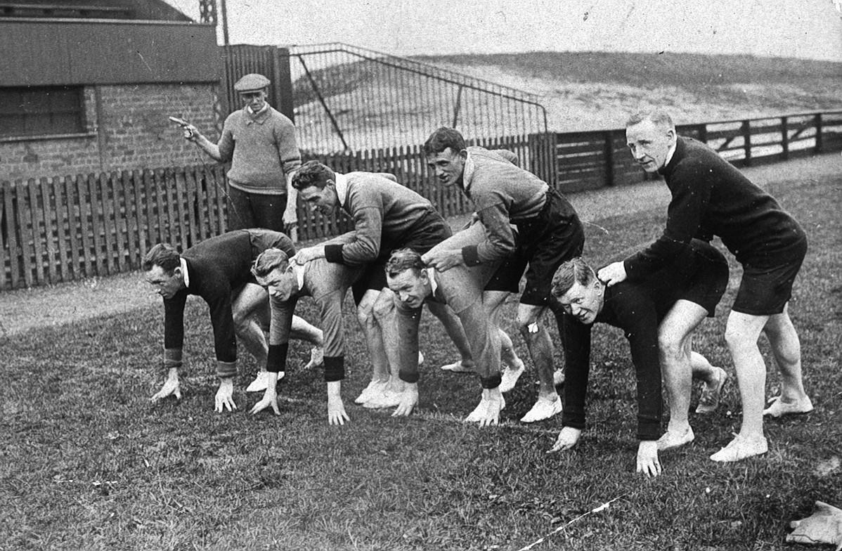 Falkirk F C players training on running track at Brockville Falkirk